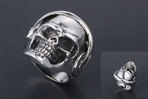Macro detail of punk skull ring with headphones in vintage silver stainless steel finish