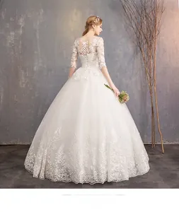 Detailed view of the sheer lace back and elegant lace-up closure of the bridal gown