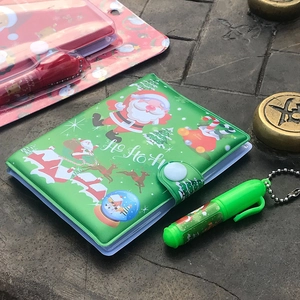Christmas portable notebook set with cute Santa design and matching mini ballpoint pen.