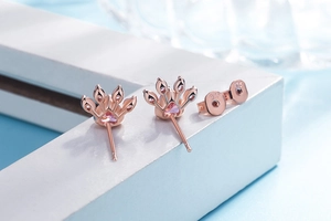 Detailed close-up of S925 sterling silver stamp on rose gold cat paw earring