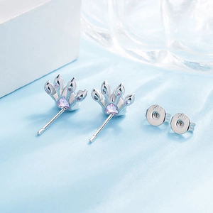 Close-up of S925 sterling silver crown studs with purple heart-shaped zircon stones