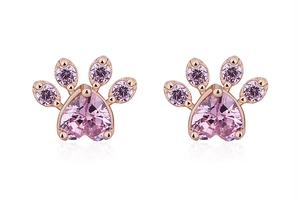 Close-up of rose gold cat paw stud earrings with heart shaped pink crystal stones
