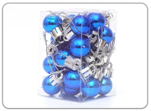 Blue mini Christmas tree ornaments in a transparent box with shiny finish and silver caps