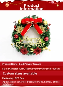Detailed view of green Christmas wreath with red bows, gold balls and Merry Christmas sign