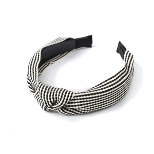 Classic black and white striped knotted headband with premium woven texture for women