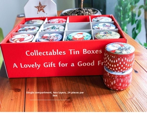 Detailed set of 24 Christmas tin boxes in a red gift package with holiday illustrations