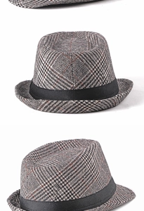 Detail shot of the glen plaid pattern and black ribbon on a classic wool fedora hat