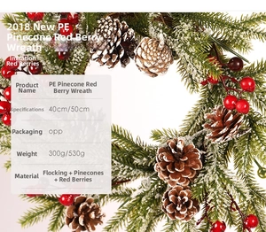 Detail of Christmas wreath with frosted pine cones and red berries in 40cm and 50cm sizes