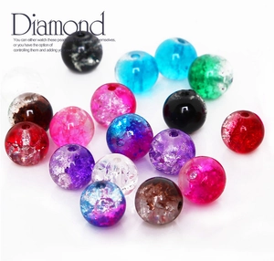 Close-up of mixed colorful crackle glass beads for jewelry making and DIY crafting