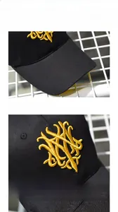 Detail von goldener 3D-Stickerei und verlängerter Krempe auf schwarzer Baumwollkappe