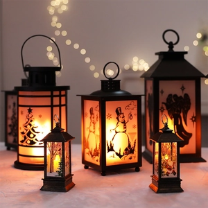Decorative Christmas flame lanterns with snowman and Santa patterns for holiday table decor