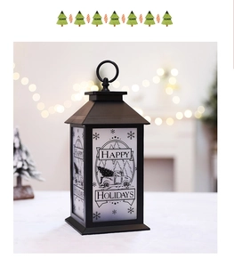 Detail of Christmas lantern with Happy Holidays truck illustration and warm background lighting