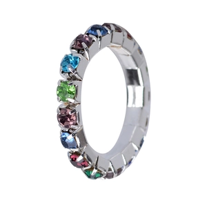 Detailed side view of silver elastic ring with three rows of colorful claw-set crystals