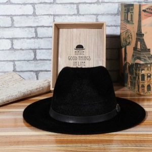 Detailed macro view of black wool fedora hat with elegant faux leather decorative belt