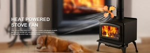 Heat powered fireplace fan with orange blades circulating warm air in a cozy home setting