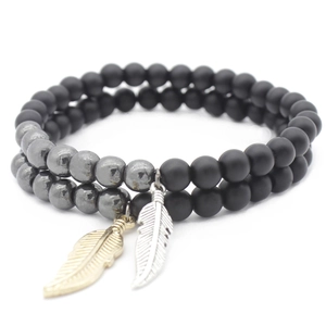 Double-strand beaded bracelet with matte black and gray beads plus feather pendants