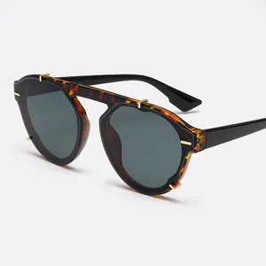 Modern retro tortoiseshell sunglasses with metal top bar and dark UV lenses