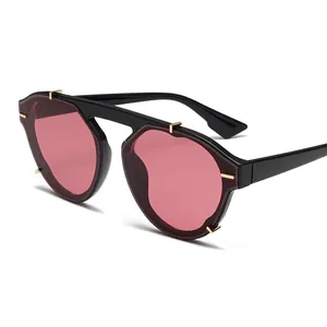 Retro black oversized sunglasses with pink gradient lenses and gold rivet accents