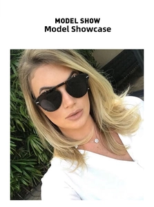 Fashionable oversized tortoise shell sunglasses shown worn by a model in a garden
