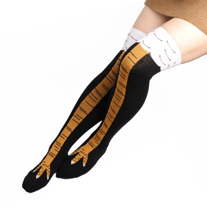 Close-up of creative chicken feet pattern on over-knee high socks with black knit fabric