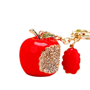 Sparkling crystal encrusted red apple keychain with gold leaf and metallic keyring