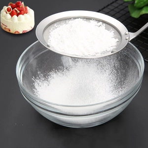 304 stainless steel fine mesh strainer sifting flour over a strawberry cake