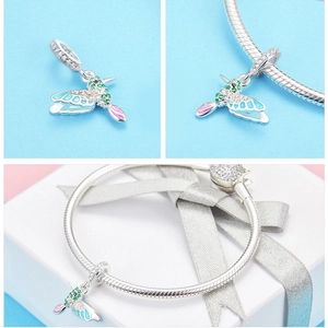 Detailed view of S925 silver hummingbird charm with colorful enamel and sparkling zircons