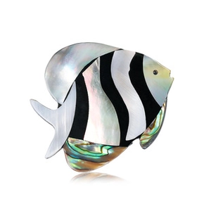 Detailed macro view of a tropical fish brooch with natural abalone shell inlay