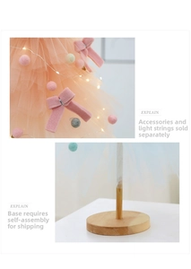 Detail of pink and blue mesh layers on a mini DIY Christmas tree with wooden base