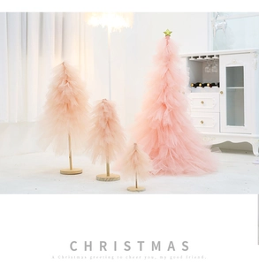 Four-piece pink mesh mini Christmas tree set with wooden bases for desktop decor