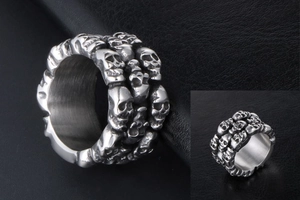 Detailed macro shot of stacked skull ring crafted in silver-tone polished titanium steel