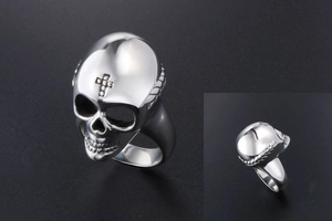 Detailed view of vintage silver skull ring featuring engraved cross on the forehead