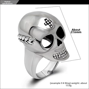 Macro detail of punk skull ring with black cross inlay and polished steel texture