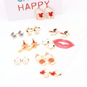 Detail of colorful enamel Snoopy cartoon charms for DIY jewelry making and crafts