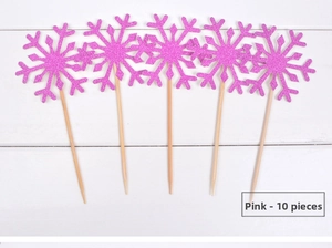 Détail de dix pics à gâteau flocons de neige rose fuchsia pailletés sur bois