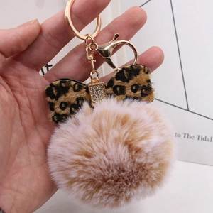 Leopard print bow and fluffy faux fur pompom keychain with golden lobster clasp and crystals