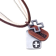 Detail of vintage bronze M52 military tag and cross pendants on leather layered necklace
