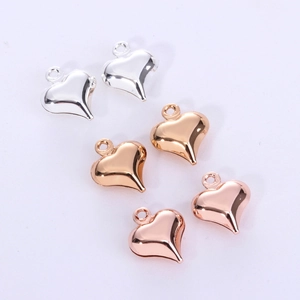 Polished heart pendants in gold, silver, and rose gold finishes for DIY jewelry making
