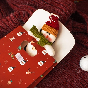 Holly Jolly Christmas gift bag featuring festive Santa and reindeer on a warm red scarf