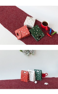 Christmas gift boxes with snowman and tree patterns in red green and white