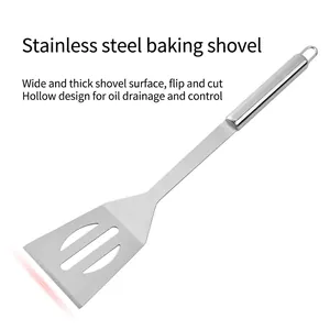 Stainless steel BBQ spatula with slotted head and hanging loop on a white background