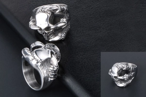 Close-up of gothic punk skeleton rings with sharp claw design in vintage steel finish