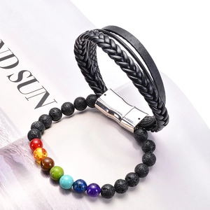 Detail of woven leather bracelet with magnetic clasp and colorful chakra lava stone beads