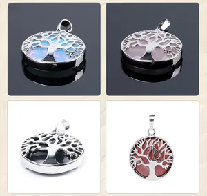 Detail view of Tree of Life pendants in various natural stones with silver plating