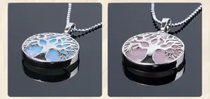 Detail of round Tree of Life necklaces with opal and rose quartz stones on a bead chain