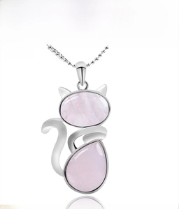 Detailed view of silver cat pendant necklace featuring pink crystal stones and ball chain
