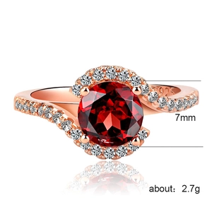 Elegant rose gold plated engagement ring with red stone and zircon pavé cross band