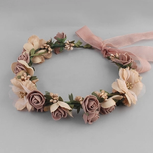 Detail of pink and beige fabric roses with adjustable ribbon on a floral headband