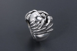 Detail view of gothic skull ring with wing carving and vintage silver finish