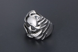 Detailed close-up of Gothic silver skull ring with wings in vintage stainless steel
